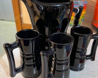 This MCM pitcher and 2 of the 3 mugs ae in great condition. The third mug has a very noticeable chip on it.