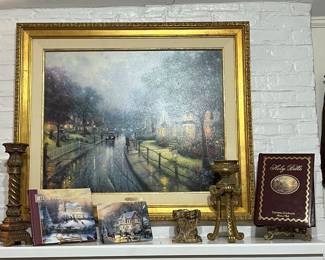 Notice the Thomas Kinkade artwork titled "Walking to Church on Sunday night. Beside the artwork is a Thomas Kinkade Bible.
