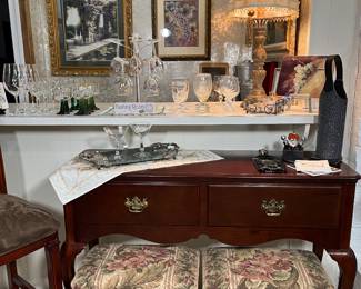 The 2-drawer sofa table measures 48w x 16d x 34h.