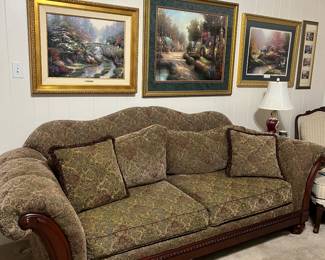 The oversized couch measures 96" and is 40" deep. The couch and its matching loveseat are in excellent condition. Notice the Thomas Kinkade framed art on the wall.