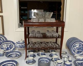 Resting on the table with Blue Willow dishes is a vintage punch bowl and cups.