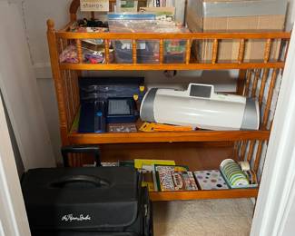 This is a glimpse into the craft closet located in the toy room. It is full of adult craft supplies.