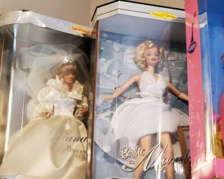 Princess Di and Marilyn.  I bet they have had some awesone conversations on that shelf.  