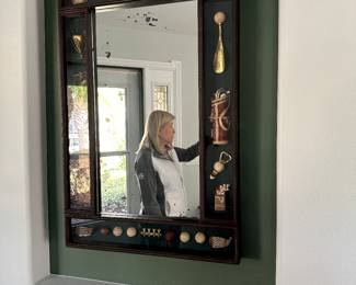 Golf features around mirror