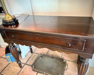 Vintage campaign-style desk shown closed