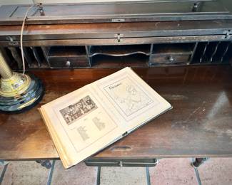 Vintage campaign-style desk and old yearbook