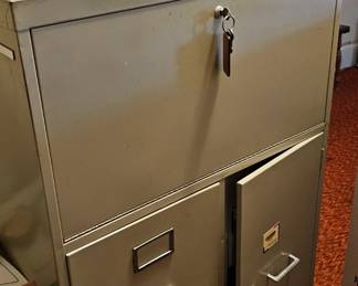 Filing cabinet with safe.  Keys and combination included. 