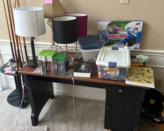 lamps, Xbox games, legos, model plane, weights, desk