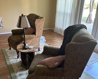 Upholstered chairs, end table, area rug, lamps