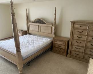 five piece bedroom set. King size, four post with complete frame and headboard as well as three end-tables and a large wall dresser. The mattress is less than a year old. 