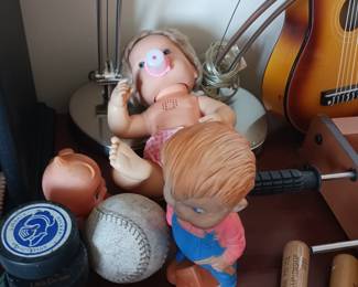 Hockey pucks, squeak toys, dolls