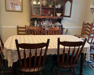 Table with crochet table cloth.