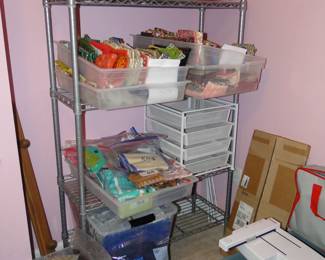 Boxes, bags, totes, and bins, along with metal shelving too.  Lots of craft and sewing supplies too!