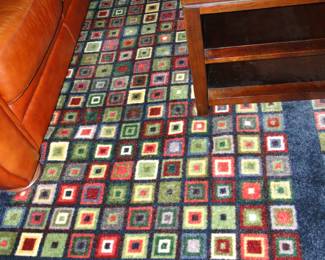 Another large area rug that brings a lot of life and color into a room