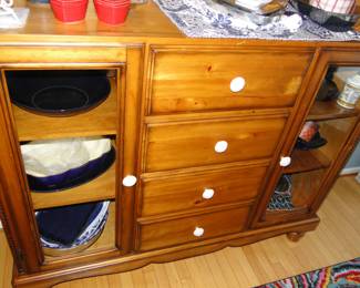 Lots of practical uses for this side board, storage galore, and lots of space for display