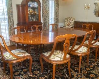 Dining room table and 8 chairs. Table is 50" wide x 58" long (without leafs) and 29 1/4" tall.  2 leafs 24" wide each extend the table to 7 ft 2" long!
