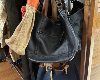 lots of designer and leather bags