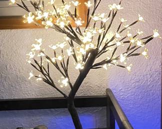 Vintage "Cherry Blossom" Tree made from fiber optic light. The blossoms easily twist to remove for cleaning. Metal base. 
Approx 14" tall 