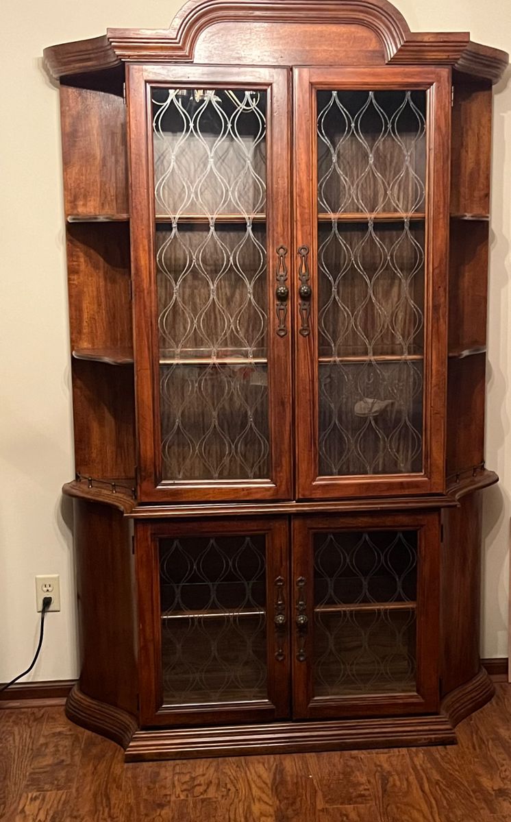 Pecan china cabinet with embossed etching on glass