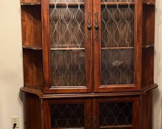 Pecan china cabinet with embossed etching on glass