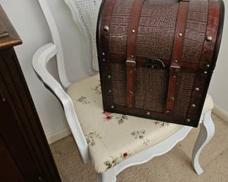 There are three white Dining Chairs like this