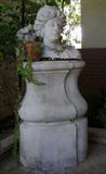 Stone head of woman from French garden. Custom made plinth.