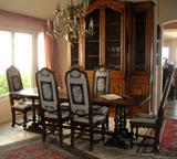 Oak refectory table. Six 17th century Italian high back chairs covered in needlepoint.