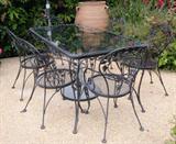 Woodard wrought iron patio table with 6 chairs