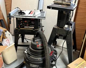 Several nice power tools including a band saw, 