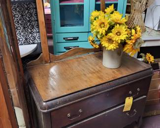 Vintage 2 drawer chest on wheels with towel rack.