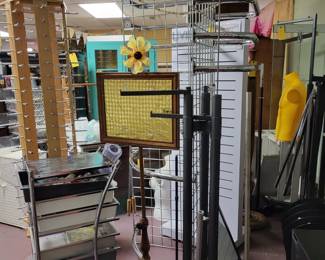 Clothing racks, sign holders, maniquind and fixtures galore.