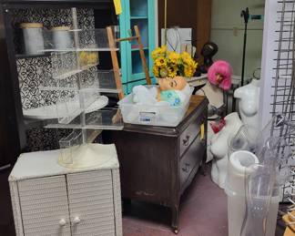 Shelves, cabinets display fixtures and tons of items.