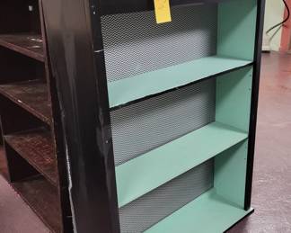 Black painted shelf with teal painted interior.