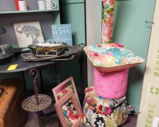 Various home decor stools, mirrors, frames, rugs and signs.