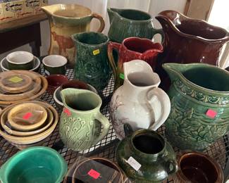 Loads of beautiful pitchers and bowls.