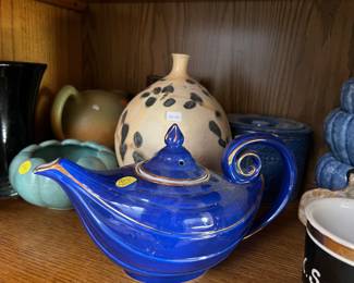 Lots of beautiful tea pots. This one makes wishes come true!