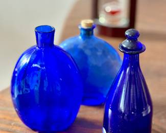 Variety of vintage cobalt blue bottles 