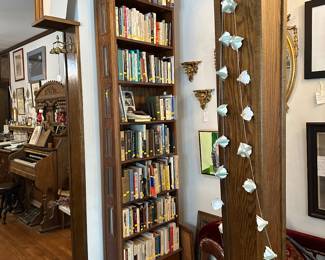 Beautiful tall and narrow bookcase with bevelled glass inserts on each side