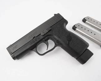 Looking for a dependable everyday carry piece? Don’t miss this Kahr P9 chambered in 9mm. The frame is polymer, grips are textured and both are black. The stainless-steel slide wears a blackened matte finish, and the barrel's polygonal rifling is twisted 1:10". The P9 is double-action only and is semi-automatic. The pistols ship with a pair of 8-round magazines and 1 7-rounder. Sights are drift adjustable and contain tritium. The pistol is in excellent condition, showing normal signs of use and wear.