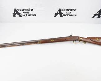 This Hawken Kentucky Style black powder rifle is chambered in .50 BP. The muzzleloader rifle features a 33” barrel and ornately engraved stock including the Presidential seal. The rifle is in excellent condition, showing normal signs of use and wear.