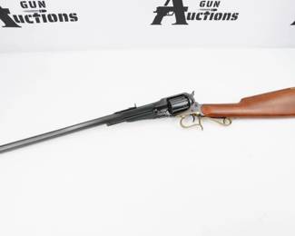 This is one of the first cap and ball revolving carbines. The easy handling and reliability of this carbine makes it a pleasure to shoot. About 3,000 original guns were produced between 1866 and 1879. This authentic reproduction is in 44 caliber with an 18" tapered octagon barrel, blue steel frame, brass trigger guard, 6-shot cylinder, adjustable rear sight and walnut stock. This Rifle is in Excellent condition showing normal signs of use and wear.