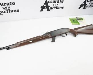 Remington Mohawk 10 C in .22 Long Rifle with (1) 5-round removable magazine. Serrated composite butt plate. Checkered composite stock and front forend. Composite trigger guard, serrated charging handle and serrated trigger. Blued metal receiver and barrel. Magwell located serrated magazine release. Rear adjustable and front fixed blade sight. Comes with original box and rifle sleeve. 