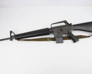 Colt started selling the semi-automatic version of the M16 rifle as the Colt AR-15 in 1964. The first mass production version was the Colt AR-15 Sporter, in .223 Remington, with a 20-inch barrel, issued with 5-round magazines.This rifle was manufactured in 1964 as dated by the serial number, SP02212 . The rifle has all of the correct early features including the three-prong flash hider, post front sight, bayonet lug, ventilated triangular handguard, fixed carry handle, two leaf windage adjustable rear peep sight, checkered grip, and fixed butt stock without the trapdoor buttplate. This rifle is in excellent condition and is sold with one original magazine and a sling.https://accurategunauctions.hibid.com/lot/183826567/colt-sp1--223-5-56mm?ref=catalog