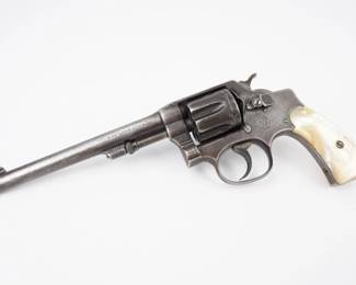 The first Smith & Wesson to have a swing-out cylinder, even though after the First Model many innovations were actually driven by, and appeared first in, the larger (K frame) Smith & Wesson revolvers in .38 S&W Special or .32 Winchester. This Smith & Wesson Hand Ejector, M 1903, 5th change (1910-1917).32 S&W Long. A Classic revolver in good condition, a piece of firearm history. Well-maintained and functional, perfect for collectors or enthusiasts.