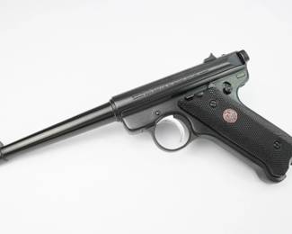 Here we have a very nice Ruger MkII Target pistol in .22 long rifle caliber. The MK II ("Mark Two") was made from 1982 to 2005. It replaced the Standard, Ruger's first model, made from 1949 to 1982, and the MK I Target, made from 1951 to 1982. MK II variations include the Target models, which have heavier barrels and adjustable sights, and the 22/45 models, which have a polymer frame with a grip-angle that matches the Colt 1911 rather than the steel frame's Luger P08–like layout. Being a Mark II it has a heel style magazine release. This pistol is in excellent condition showing normal signs of use and wear.