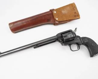 The Colt Buntline Special was a long-barreled variant of the Colt Single Action Army revolver, which Stuart N. Lake described in his best-selling but largely fictionalized 1931 biography, Wyatt Earp: Frontier Marshal. The serial number indicates this was made in 1964. Featuring a 9.5 inch barrel chambered in 22 MAG. Comes with a leather holster. This Revolver is in excellent condition showing normal signs of use and wear. 