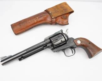 The Ruger Blackhawk is a six-shot, single-action revolver manufactured by Sturm, Ruger & Co. Ruger introduced the Blackhawk in 1955. Chambered for the .357 Magnum, the Blackhawk was a simple and strong design. This revolver was manufactured in 1971 as indicated by the serial number (30-89527) and is fully engraved by J.Muns. The beautiful firearm features a nickel finish with ivory tone grips with a Buck’s head engraved in the grip. This one of a kind revolver is in excellent condition showing little to no signs of use or wear. 