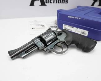 Released during the economic downfall of the Great Depression, the Smith and Wesson Model 27 revolver remained in high demand because of its outstanding quality, dependability, and durability, despite being an expensive firearm option at the time. This sidearm also offered versatility in ammunition, with capabilities of shooting both .357 Magnum and .38 Special, making it a popular choice. This 27-9 is in excellent condition and comes with the factory hard case. 