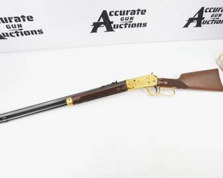 Winchester 1894 rifle in .38-55, manufactured in 1980 to honor the impact Oliver F. Winchester had on the history of the United States. The rifle features deluxe checkering on the grip and forend, engraved matte gold plated receiver and matte gold lever, forend cap and magazine plug. The rifle is in Excellent condition showing little to no sign of use and comes in its original box. This will make a great addition to a Winchester or any American firearms collection. 
