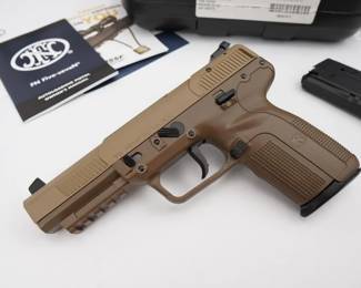 The original FN Five-seveN, often imitated but hardly duplicated, has two decades of trusted service with allied armies, global law enforcement and civilians. Extending its groundbreaking design is a new, all flat dark earth frame and slide. With improved range and accuracy over common pistol cartridges, the NATO standardized 5.7x28mm developed by FN Herstal is fired from the chrome-lined cold hammer-forged barrel. Pinpoint accuracy and minimal felt recoil is standard issue. Equipped with an internal hammer, the smooth trigger with a predictable break further enhances accuracy. This pistol is in new condition and is dressed in the FDE finish and comes with the factory case and two magazines. 